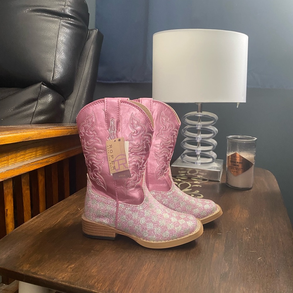 Pink shiny new cowgirl boots